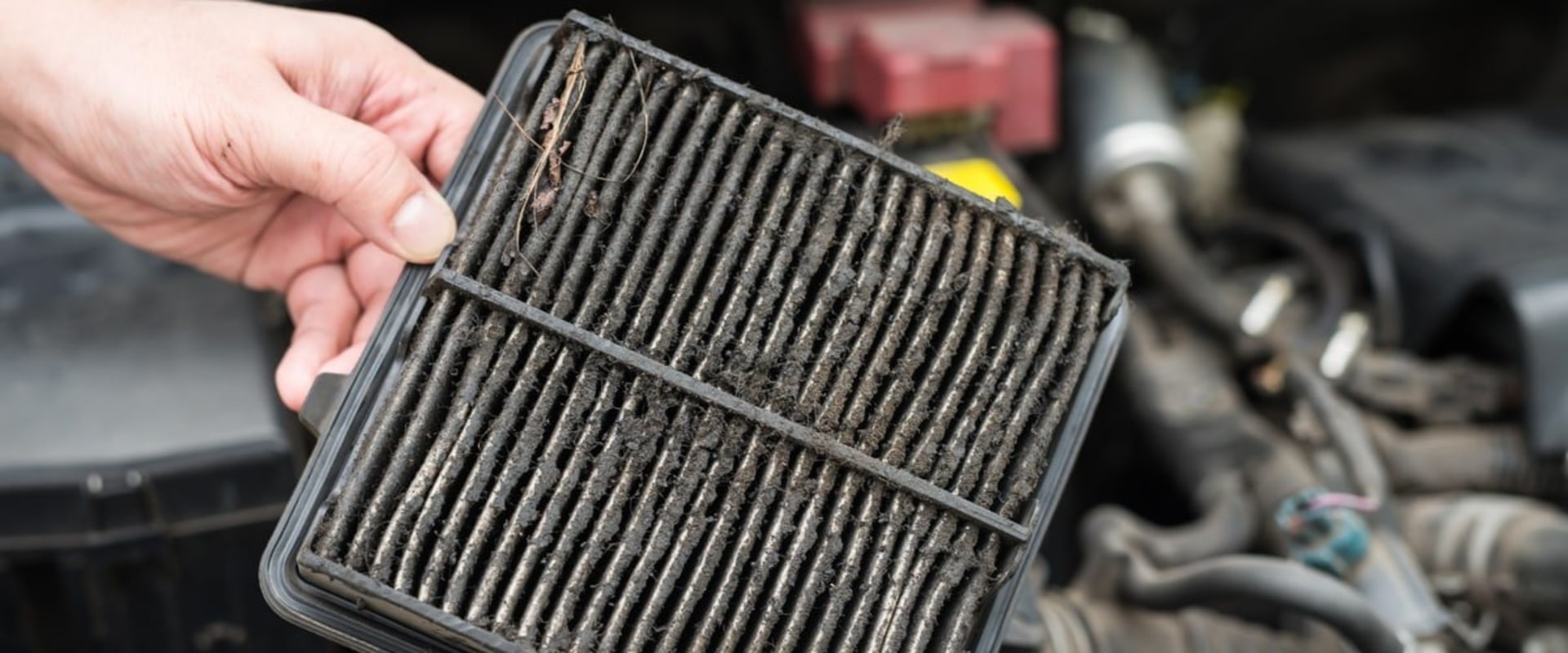 What are the symptoms of a dirty engine air filter?